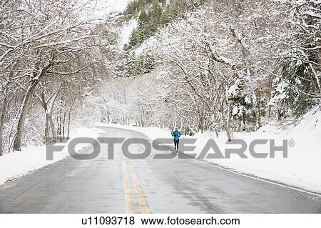 Stock Photo - Woman jogging in winter . Fotosearch