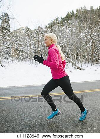 Woman jogging in winter View Large Photo Image Stock Photograph - Woman jogging in winter. Fotosearch