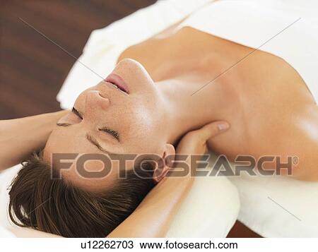 Woman receiving massage in spa View Large Photo Image Stock Image - Woman receiving massage in spa. Fotosearch