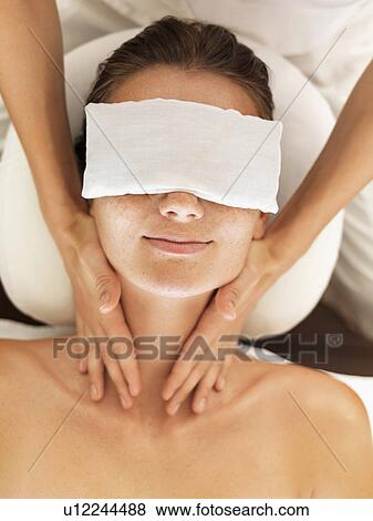 Stock Photo - Woman receiving massage in spa. Fotosearch