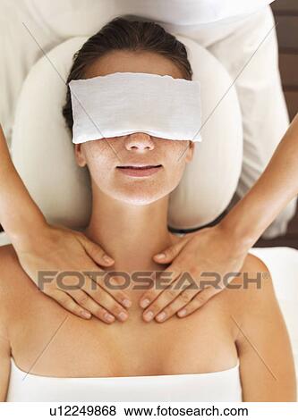 Stock Photo - Woman receiving massage in spa. Fotosearch