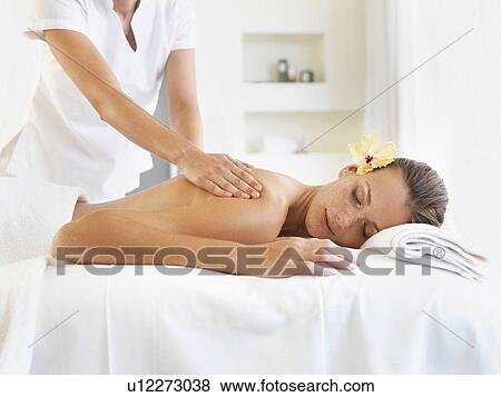 Woman receiving massage in spa View Large Photo Image Stock Photo - Woman receiving massage in spa. Fotosearch