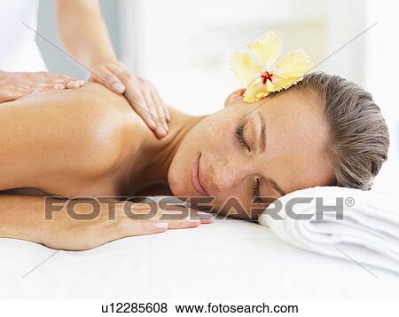 Woman receiving massage in spa View Large Photo Image Stock Photo - Woman receiving massage in spa. Fotosearch