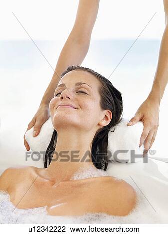 Stock Image - Woman receiving spa therapy. Fotosearch