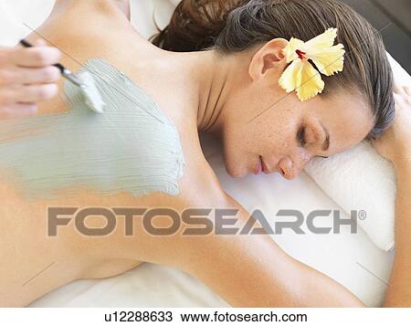 Stock Image - Woman receiving spa treatment. Fotosearch