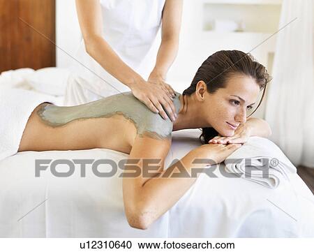 Stock Image - Woman receiving spa treatment. Fotosearch