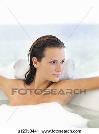 Woman relaxing in bathtub View Large Photo Image Stock Image - Woman relaxing in bathtub. Fotosearch