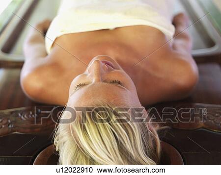Stock Image - Woman relaxing in spa. Fotosearch