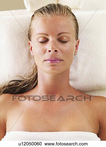 Stock Image - Woman relaxing in spa. Fotosearch