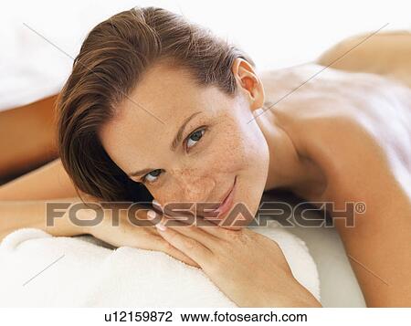 Stock Image - Woman relaxing in spa. Fotosearch