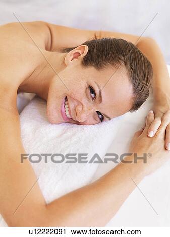 Stock Image - Woman relaxing in spa. Fotosearch