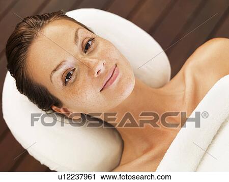 Stock Image - Woman relaxing in spa. Fotosearch