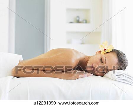 Stock Image - Woman relaxing in spa. Fotosearch