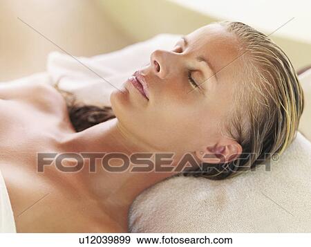 Woman relaxing in spa View Large Photo Image Stock Photo - Woman relaxing in spa. Fotosearch