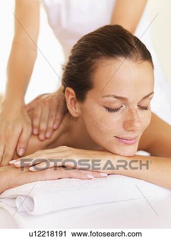 Woman relaxing while getting massage View Large Photo Image Stock Image - Woman relaxing while getting massage. Fotosearch