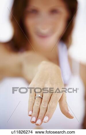 Woman showing wedding ring View Large Photo Image Picture - Woman showing wedding ring. Fotosearch