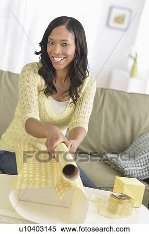 Woman wrapping presents View Large Photo Image Stock Photography - Woman wrapping presents. Fotosearch