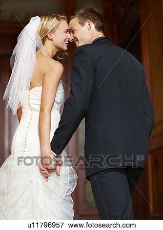 Stock Photo - Young couple looking at each other. Fotosearch