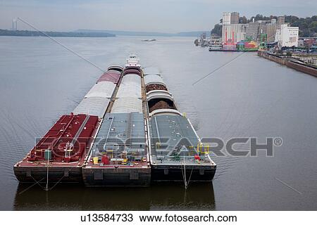 A river barge passes by Alton, Illinois down the Mississippi River View Large Photo Image Stock Image - A river barge passes by Alton, Illinois down the Mississippi River. Fotosearch