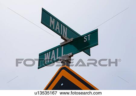 A road sign is the intersection of Main Street and Wall Street View Large Photo Image Stock Photo - A road sign is the intersection of Main Street and Wall Street. Fotosearch