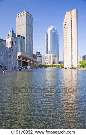 Stock Image - Boston Skyline and water reflecting pond. Fotosearch