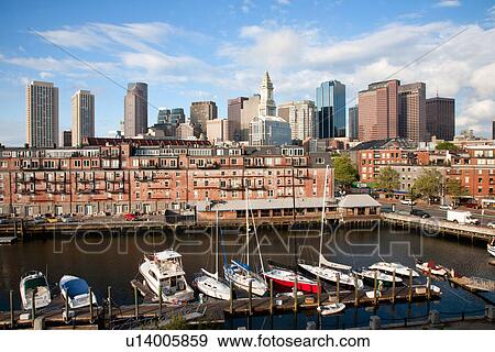 Boston Skyline at sunrise features Commerce House Tower and Harbor, Boston, MA. View Large Photo Image Stock Photo - Boston Skyline at sunrise features Commerce House Tower and Harbor, Boston, MA.. Fotosearch
