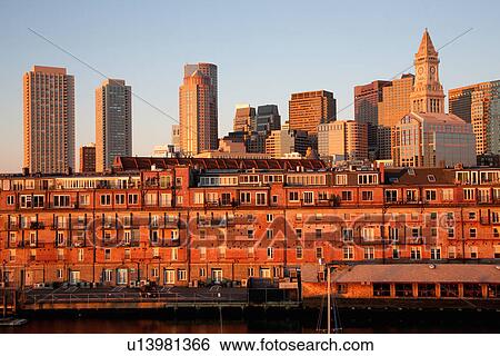 Boston Skyline at sunrise features Commerce House Tower, Boston, MA. View Large Photo Image Stock Photograph - Boston Skyline at sunrise features Commerce House Tower, Boston, MA.. Fotosearch