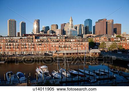 Boston Skyline at sunrise features Commerce House Tower and Harbor, Boston, MA. View Large Photo Image Stock Photography - Boston Skyline at sunrise features Commerce House Tower and Harbor, Boston, MA.. Fotosearch