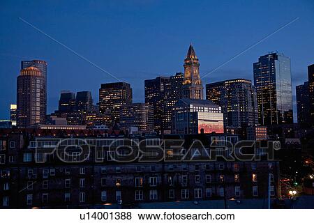 Stock Photo - Boston Skyline at sunset features Commerce House Tower, Boston, MA.. Fotosearch