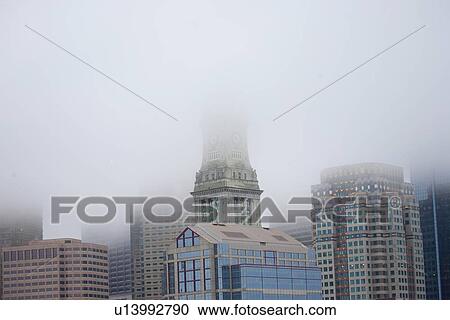 Boston Skyline in fog features Commerce House Tower, Boston, MA. View Large Photo Image Stock Image - Boston Skyline in fog features Commerce House Tower, Boston, MA.. Fotosearch