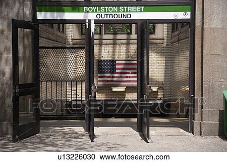 Stock Image - Boylston Street Outbound Train and US Flag, Boston, MA. Fotosearch