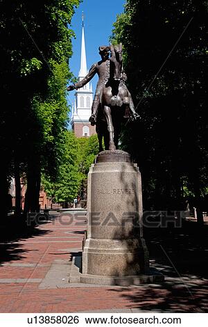 Stock Photograph - Bronze Statue of Paul Revere on horse, Freedom Trail with Old North Church in background, Boston, MA. Fotosearch