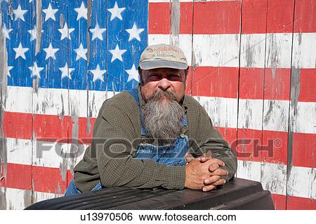 Howard poses in front of US Flag on Old Barn, Maine View Large Photo Image Stock Photograph - Howard poses in front of US Flag on Old Barn, Maine. Fotosearch