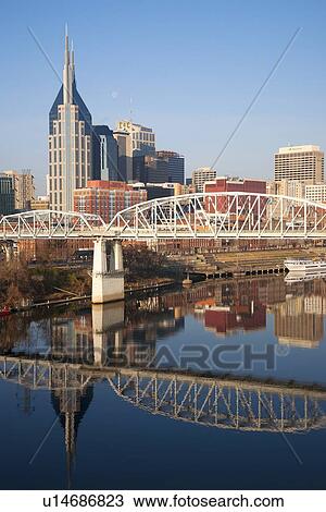 Stock Image - Nashville Skyline, Tennessee and the Cumberland River with river reflection. Fotosearch
