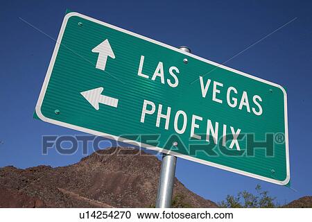 Stock Image - Road sign points to Las Vegas and Phoenix. Fotosearch