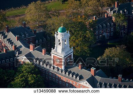 Stock Photo - Sunrise Aerials of Eliot House Clock Tower, Harvard, New England. Fotosearch