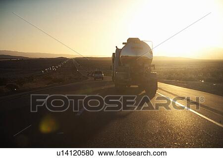 Truck into setting sun on Interstate 15 in California View Large Photo Image Stock Image - Truck into setting sun on Interstate 15 in California. Fotosearch