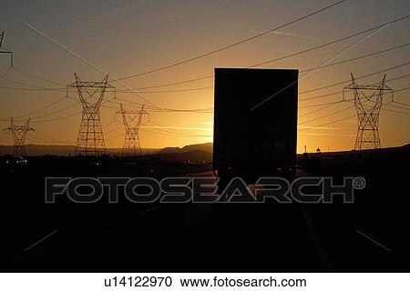 Truck into setting sun on Interstate 15 in California View Large Photo Image Stock Image - Truck into setting sun on Interstate 15 in California. Fotosearch