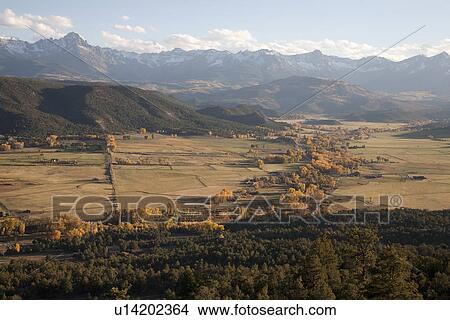 Valley view of San Juan Mountains looking toward Telluride Colorado, near Ridgeway, CO View Large Photo Image Picture - Valley view of San Juan Mountains looking toward Telluride Colorado, near Ridgeway, CO. Fotosearch