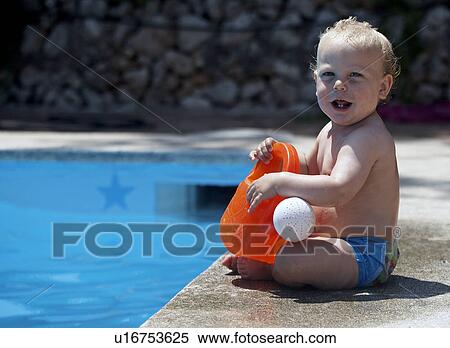 Baby boy sitting by swimming pool View Large Photo Image Stock Photography - Baby boy sitting by swimming pool. Fotosearch