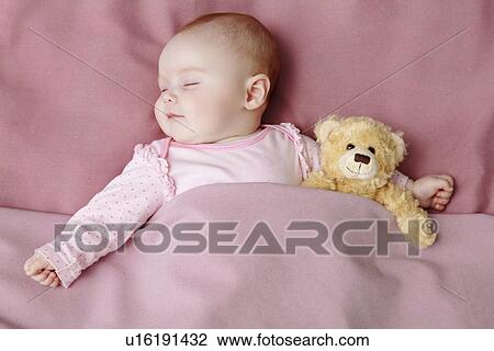 Baby girl sleeping in bed View Large Photo Image Stock Image - Baby girl sleeping in bed. Fotosearch