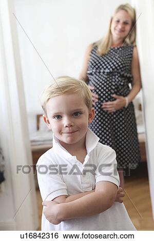Boy smiling in bedroom View Large Photo Image Stock Photograph - Boy smiling in bedroom. Fotosearch