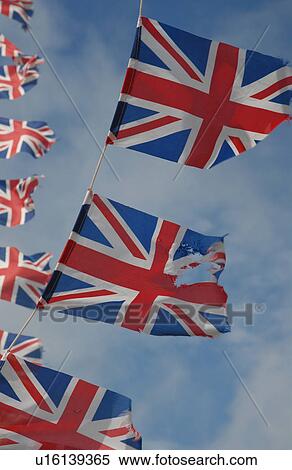 British flags flying in sky View Large Photo Image Stock Photography - British flags flying in sky. Fotosearch