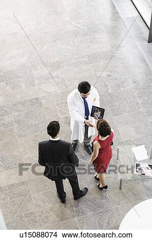 Business people and doctor greeting View Large Photo Image Picture - Business people and doctor greeting. Fotosearch