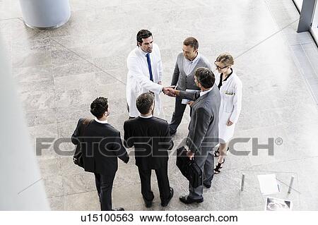Business people and doctors greeting View Large Photo Image Stock Image - Business people and doctors greeting. Fotosearch