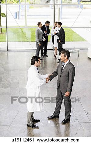 Business people and doctors greeting View Large Photo Image Stock Image - Business people and doctors greeting. Fotosearch