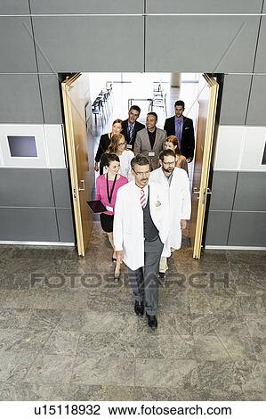 Business people and doctors in doorway View Large Photo Image Stock Image - Business people and doctors in doorway. Fotosearch