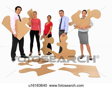 Business people doing jigsaw puzzle View Large Photo Image Stock Image - Business people doing jigsaw puzzle. Fotosearch