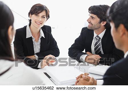 Business people talking in meeting View Large Photo Image Stock Image - Business people talking in meeting. Fotosearch