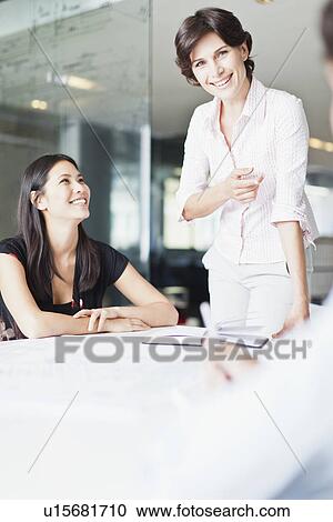Business people talking in meeting View Large Photo Image Stock Image - Business people talking in meeting. Fotosearch